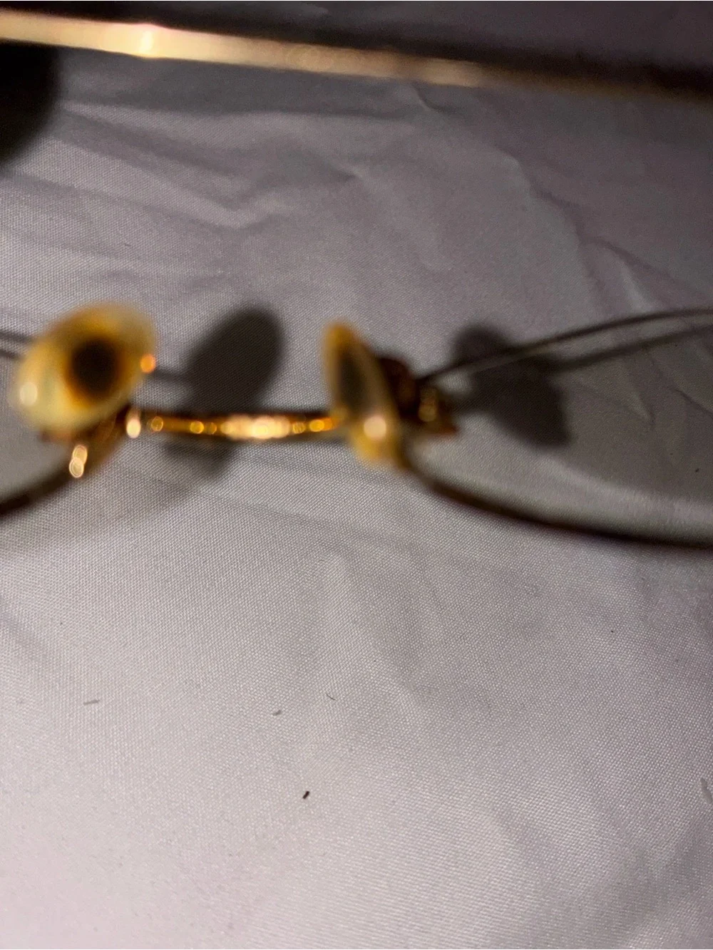Cartier Gold Rimless Women's Glasses with Subtle Pink Temples